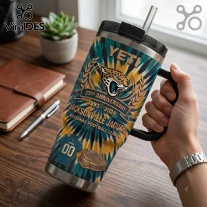 Jacksonville Jaguars 33rd Anniversary YETI 40oz Tumbler with team logo, teal and gold tie-dye pattern, and metal straw.