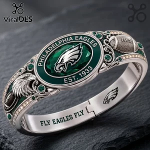 Philadelphia Eagles Silver Tone Engraved Bracelet featuring a central green oval team logo and etched football motifs.