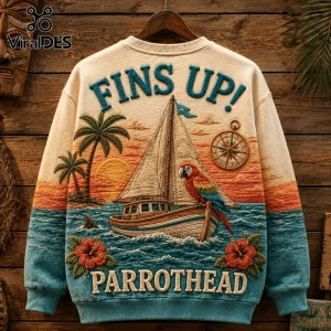 Jimmy Buffett Margaritaville embroidered sweater in beige featuring a sailboat, sunset, parrot, and tropical palms.
