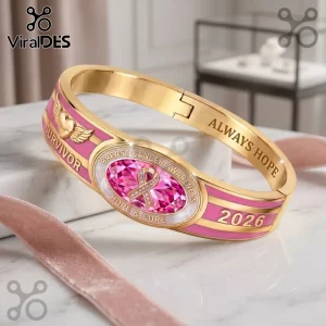 Breast Cancer Awareness 2026 Survivor Hinged Bracelet with pink enamel, gold-tone metal, and a central crystal pink ribbon.