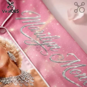 Marilyn Monroe 100th Anniversary Pink Satin Pajama Set featuring silver cursive text and a detailed portrait print.