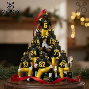Iowa Hawkeyes Football Players 2026 Christmas Ornament featuring seven small figures in team uniforms on a round base.