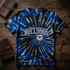 Canterbury Bankstown Bulldogs mascot shirt with a blue and black tie-dye pattern on a wooden surface.