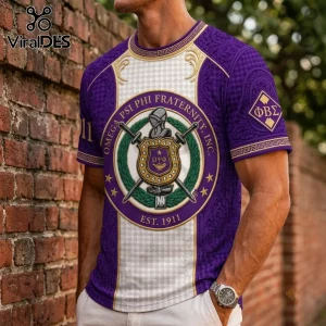 Omega Psi Phi Fraternity Purple Crest T-Shirt featuring a central shield logo, Greek letters, and gold ornate accents.