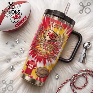 Kansas City Chiefs Tie-Dye 66th Anniversary Stanley Tumbler with gold logo, stadium graphic, and red and yellow spiral pattern.