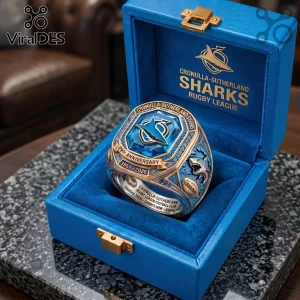 Cronulla-Sutherland Sharks 59th Anniversary Ring featuring a large blue center stone and gold detail in a velvet blue box.