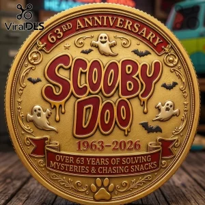 Scooby Doo Mystery Machine 63rd Anniversary Coin featuring red lettering, ghost motifs, and engraved dates on gold metal.