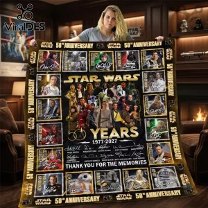 Star Wars 50th Anniversary 1977-2027 quilt blanket featuring character portraits, signatures, and gold text on black fabric.