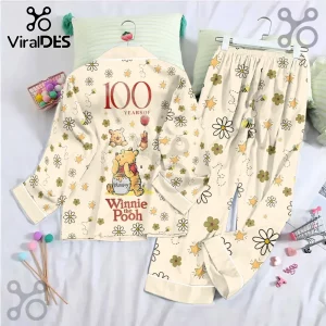 Winnie the Pooh 100th Anniversary Satin Pajama Set in cream with yellow floral print and Pooh character graphics.