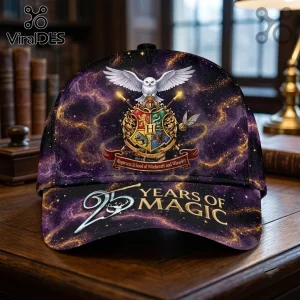 Harry Potter 25th Anniversary Purple Galaxy Cap featuring the Hogwarts crest, white owl, and 25 years of magic text.