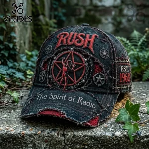 Rush 1968 Starman black distressed baseball cap with red embroidered logo, pentagram graphic, and text on a stone surface.