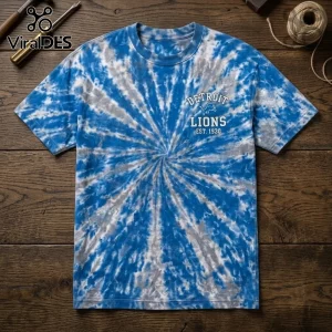 Detroit Lions NFL One Pride Special Edition Shirt in blue and grey spiral tie-dye pattern on a wooden surface.