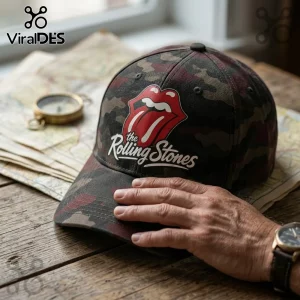 The Rolling Stones Premium Camo Baseball Cap featuring a red iconic tongue logo on a camouflage cotton fabric base.