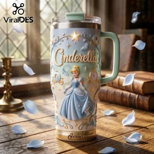 Cinderella Princess Stanley Tumbler 40oz with 3D embossed character, carriage, and clock icons on a pastel blue surface.