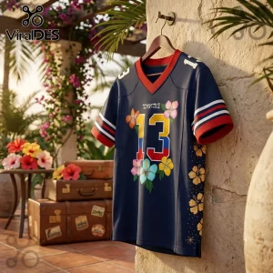 Karol G Tropitour Houston Texans Navy Blue Jersey with number 13, floral accents, and red-trimmed collar on a hanger.