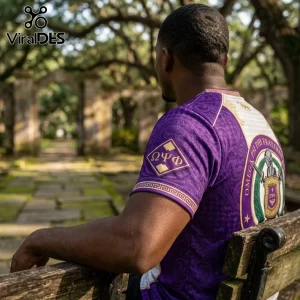 Omega Psi Phi Fraternity Purple Crest T-Shirt featuring ornate patterns, Greek letters on the sleeve, and a back emblem.