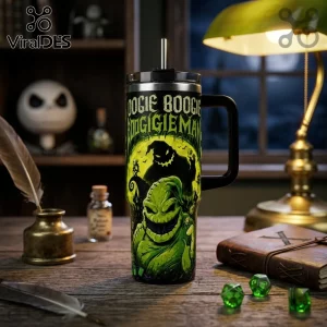 Oogie Boogie Nightmare Before Christmas 40oz Tumbler with green character graphic, straw, and black handle on wood desk.