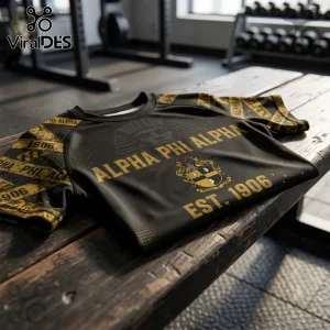 Alpha Phi Alpha 1906 Compression Turtleneck Shirt in black and gold featuring fraternity crest and text on a wooden bench.