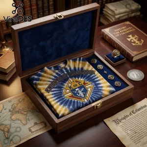 Knights of Columbus Premium Tie Dye T-Shirt folded inside a velvet-lined wooden gift box with historical accessories.