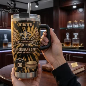 New Orleans Saints 59th Anniversary YETI Tumbler 40oz featuring a gold and black tiger stripe pattern and team logo.
