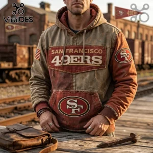 San Francisco 49ers Weathered Canvas Pullover Hoodie in brown and red with team logos and a classic distressed finish.