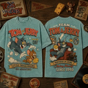 Tom and Jerry 1940 Partners in Crime T-Shirt featuring cartoon character graphics on a vintage teal acid-wash fabric background.