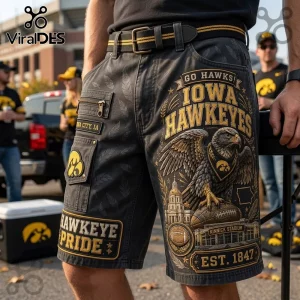 Iowa Hawkeyes Kinnick Stadium Casual Shorts featuring black denim, graphic eagle, stadium illustration, and yellow text.