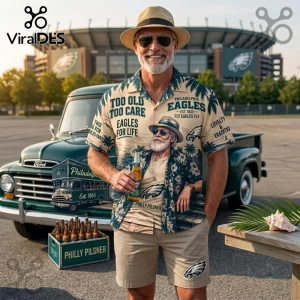NFL Philadelphia Eagles Mascot Hawaiian Shirt featuring tropical palm trees, team logos, and text against a tan background.