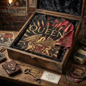 Queen The Show Must Go On tie dye t-shirt with metallic gold crest graphic resting inside a vintage wooden display box.
