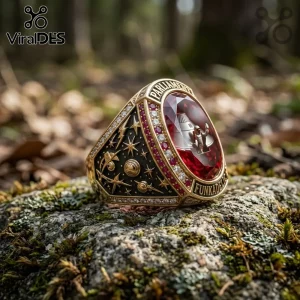 Parliament Funkadelic Mothership Red Gemstone Championship Ring with a gold band, space motifs, and a central red stone.