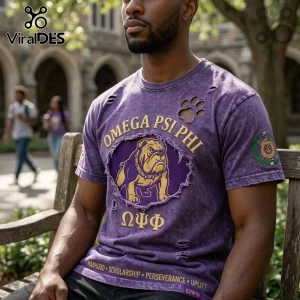 Omega Psi Phi Fraternity Mascot Distressed Shirt in purple with a gold bulldog graphic, paw prints, and Greek letters.
