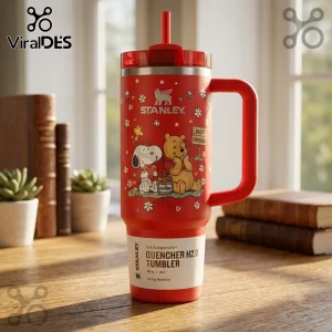 Snoopy x Winnie the Pooh Best Friends Stanley Tumbler in red, featuring cartoon characters and floral patterns on a desk.