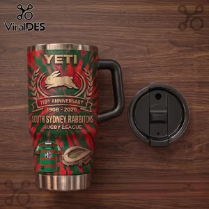 South Sydney Rabbitohs 118th Anniversary Stanley Tumbler with red and green tie-dye print on a wooden surface.