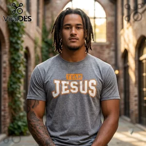 Tennessee Volunteers Team Jesus Heather Gray Shirt worn by a man with dreadlocks against a blurred brick background.