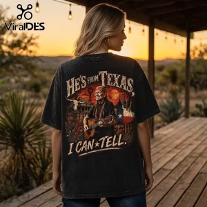 Willie Nelson He Is From Texas Vintage Washed T-Shirt on a person, featuring a country music graphic in a sunset landscape.
