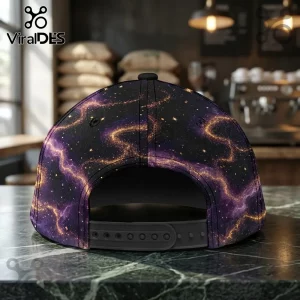 Harry Potter 25th Anniversary Purple Galaxy Cap features a dark celestial pattern with glowing golden energy swirls.