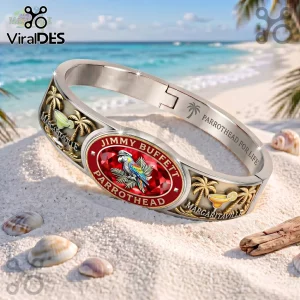 Jimmy Buffett Margaritaville gold tone engraved bracelet featuring a central red oval inlay, tropical palms, and text.