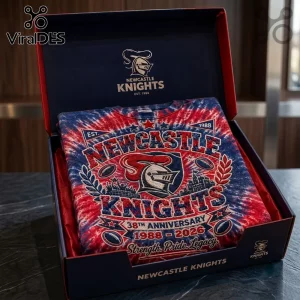 Newcastle Knights 38th Anniversary Tie Dye Shirt in a gift box with red and blue swirling patterns and team graphics.