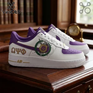 Custom Omega Psi Phi Purple Air Force 1 Sneakers featuring Greek letters, crest, and gold accents on a wooden desk background.