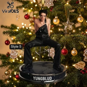 Yungblud Limited Edition 2026 Christmas Ornament featuring the artist in black overalls on a round pedestal with text.