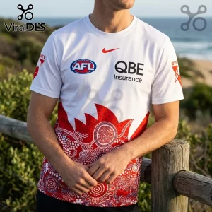 Sydney Swans White Indigenous Pattern Hoodie featuring red dot art detailing, AFL branding, and QBE logo on white fabric.