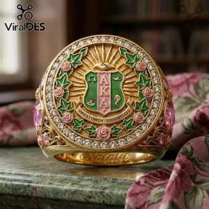 Custom Alpha Kappa Alpha Sorority ring in gold featuring green and pink enamel, ivy leaves, and white stone accents.