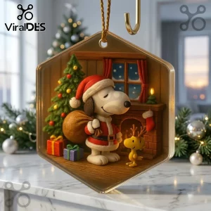 Snoopy and Woodstock Christmas Ornament 2026 featuring Snoopy in a Santa suit with a gift sack near a decorated tree.