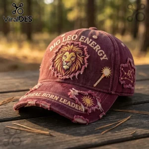Big Leo Energy Embroidered Maroon Distressed Baseball Cap features a lion head, text, and sun icon on rustic red fabric.