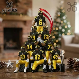 Iowa Hawkeyes Football Players 2026 Christmas Ornament featuring a pyramid of seven player figurines in black and gold gear.