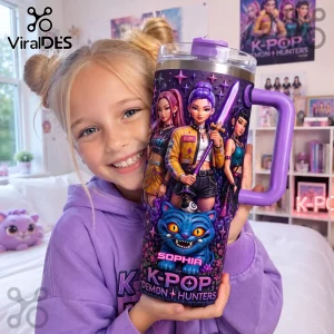 K-Pop Demon Hunters Purple 40oz Tumbler with Handle featuring anime character graphics and a blue cat mascot design.