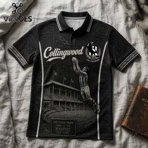 Collingwood FC Magpies Heritage Black Polo Shirt with historical stadium graphic and player leaping to catch a football.