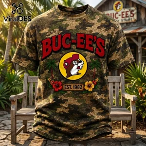 Buc-ee's Camouflage Limited Edition Shirt features a beaver logo, red text, and hibiscus flowers on a camouflage background.