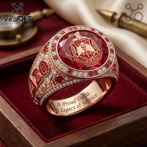 Delta Sigma Theta Gold Ruby Engraved Ring featuring a central red gemstone crest, diamond pavé, and internal engraving.