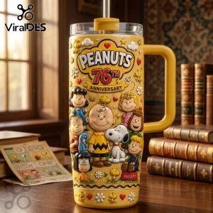 Peanuts 76th Anniversary Yellow Stanley Tumbler featuring Snoopy and friends embossed on a bright yellow metal surface.